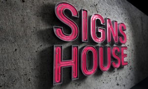 neon channel letter signs house text